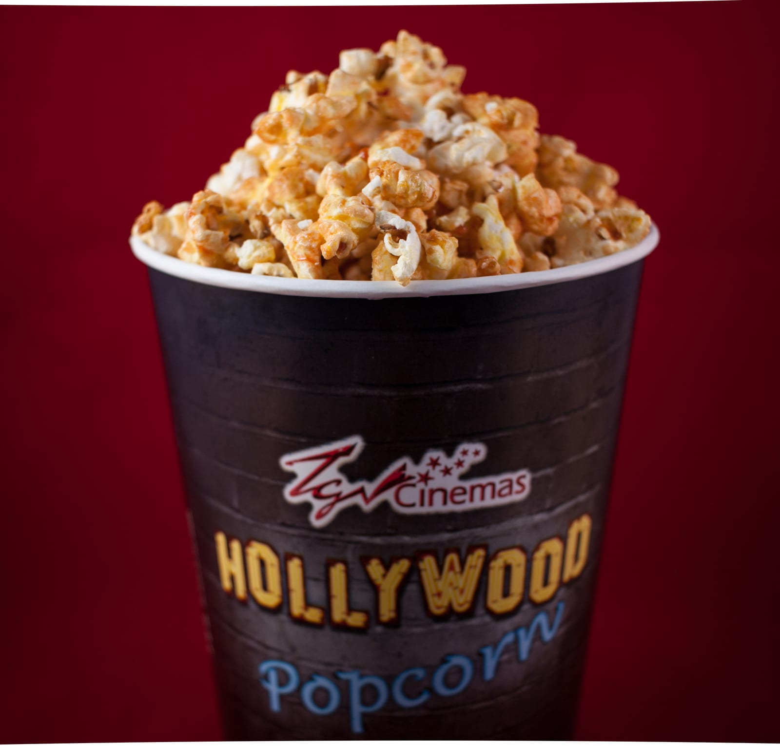 A large bucket of movie theater popcorn